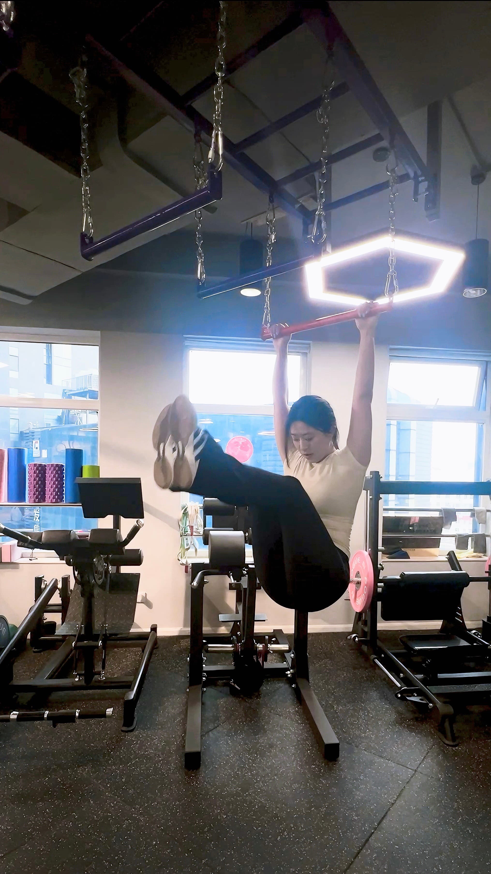 Strength training with a barbell in a gym
